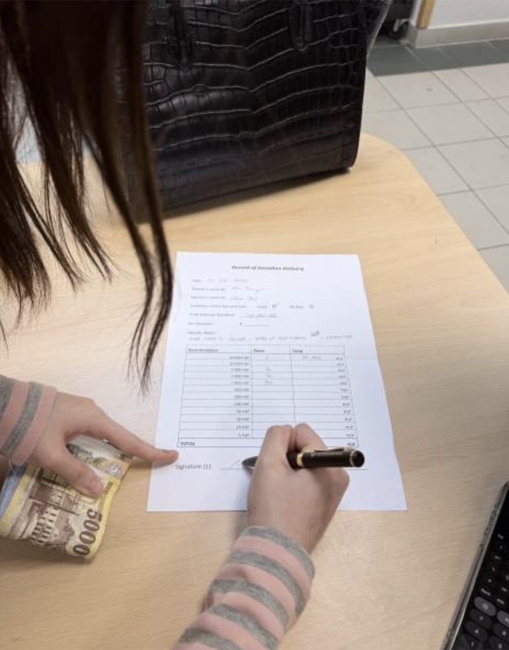 Donation accounting form being filled after fundraising